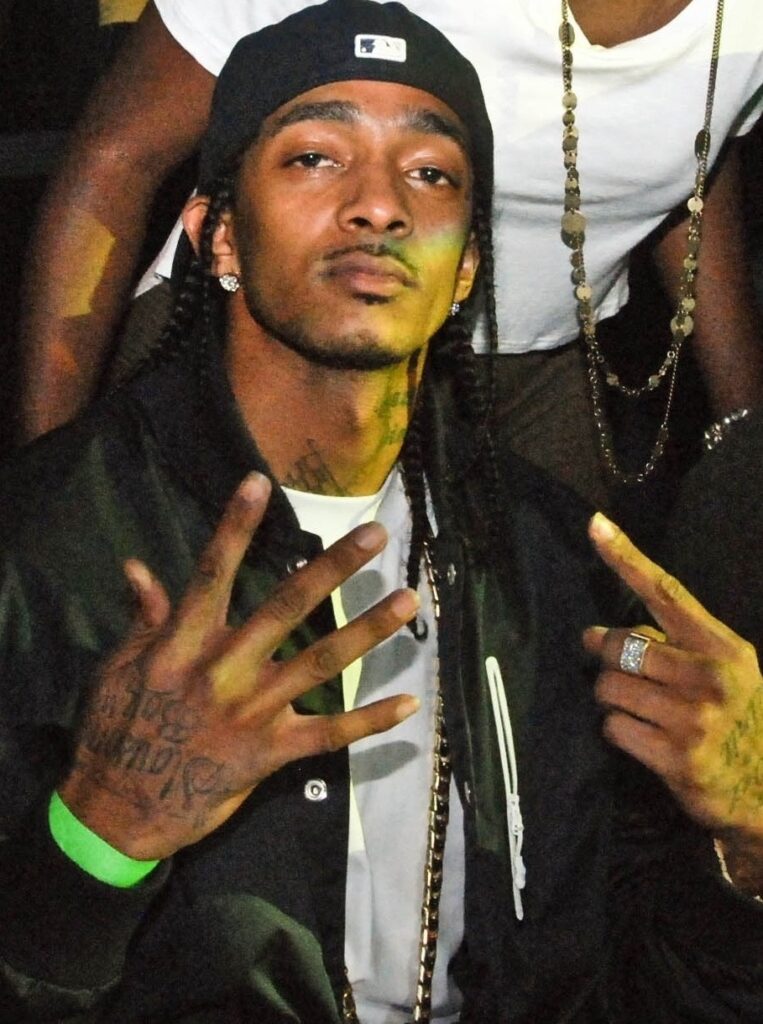 Nipsey Hussle with a mustache