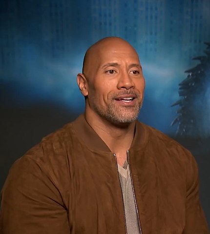 Dwayne Johnson with a bald head and a beard