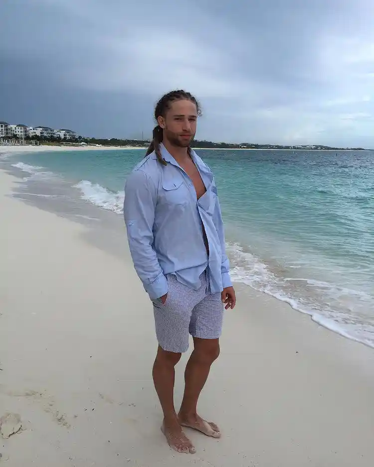 Alexander Masson modeling his beard on the beach