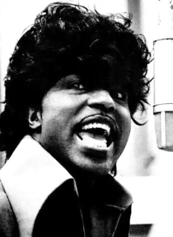 Little Richard with a thin mustache