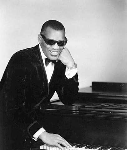Ray_Charles with sunlgasses on by piano