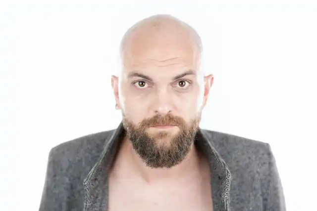 bald man with medium ducktail beard style