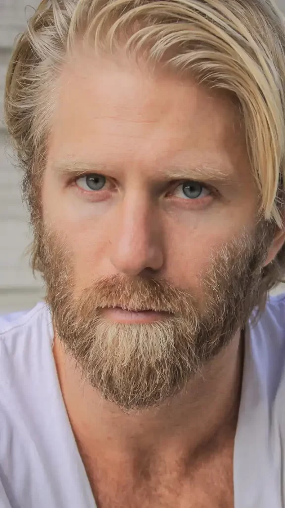 man posing with a short Ducktail beard